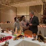 Elder-Butler-visits-with-Japanese-friends-at-the-nativity-display.jpg