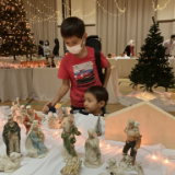 Kyle-and-Aaron-Ferguson-from-the-Okinawa-Ward-look-at-the-nativities..jpg
