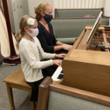 Sister-Kamie-Detterbeck-and-her-daughter,-Audrey,-play-a-piano-duet-at-the-nativity-display..jpg